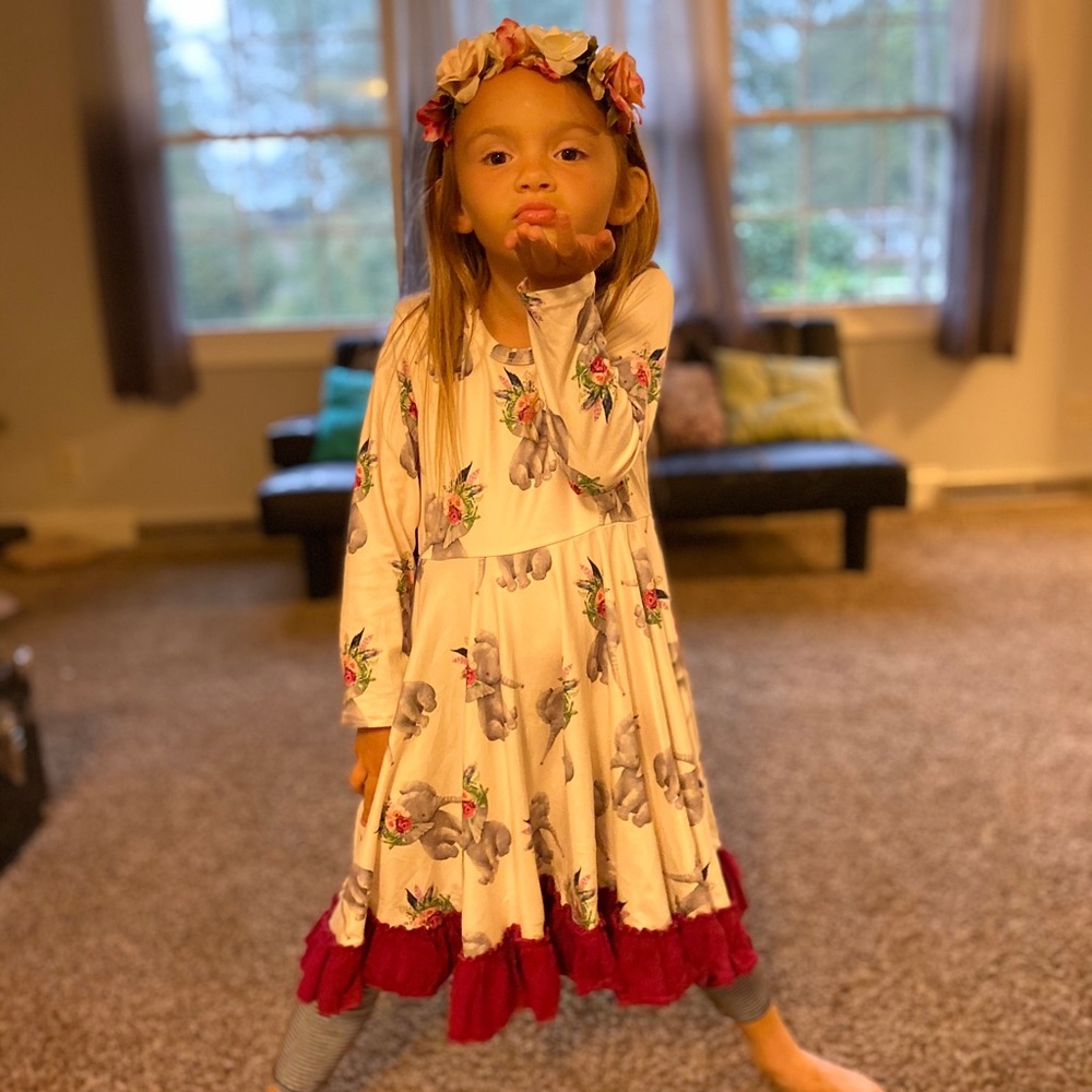 GUC size 6 boutique dress with long sleeves and accent ruffle. Elephant print.